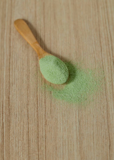istock Wooden spoon with powdered matcha green tea 1141832940