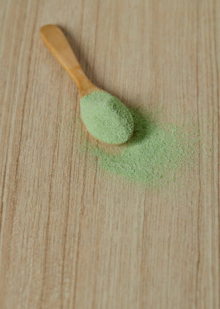 istock Wooden spoon with powdered matcha green tea 1141832949