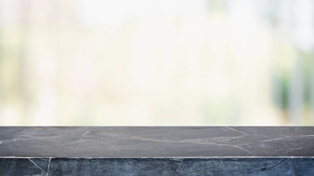 istock Empty black marble stone table top and blurred bokeh cafe and restaurent interior background - can used for display or montage your products. 1141832991