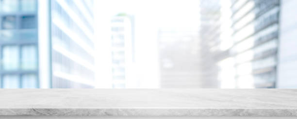 istock Empty white marble stone table top and blur glass window wall building banner mock up background - can used for display or montage your products. 1141833081
