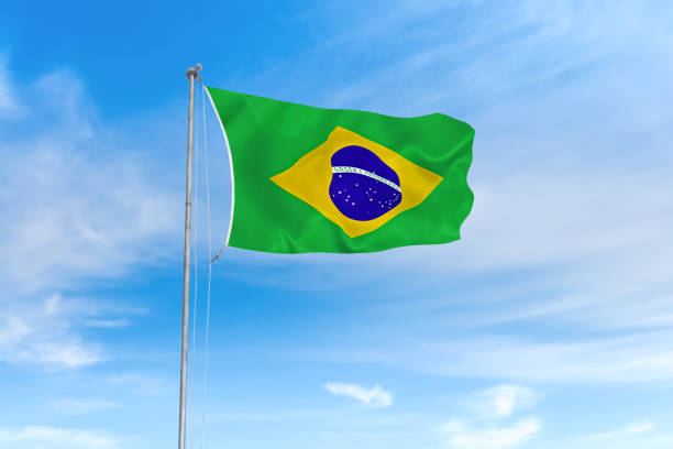 istock Brazil flag over blue sky background 1141834518