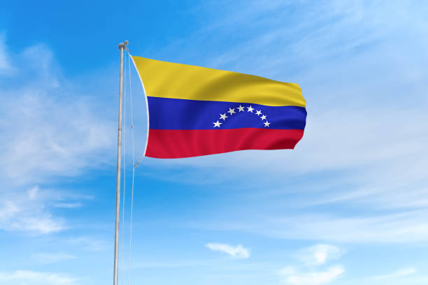 istock Venezuela flag over blue sky background 1141834588
