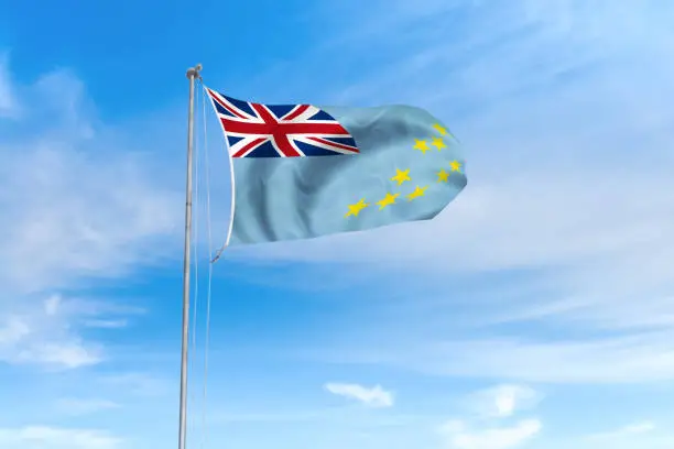 Photo of Tuvalu flag over blue sky background