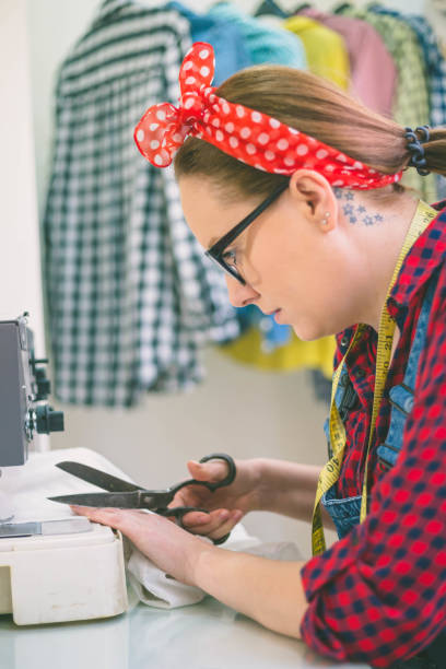 istock Seamstress woman preparing material 1141837606