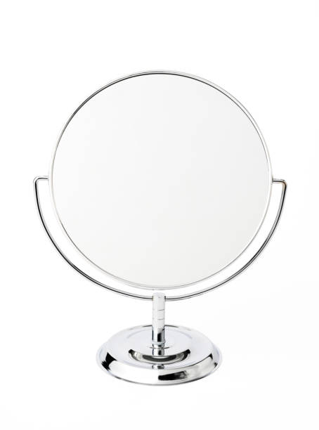 Isolated shot of silver make-up mirror on white background.
