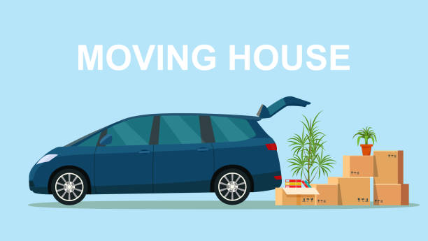 istock Things in the box next to the trunk of the minivan. Moving with boxes.  Vector flat style illustration 1141840114