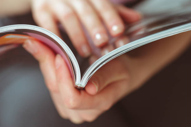 istock woman reading magazine at home 1141841944