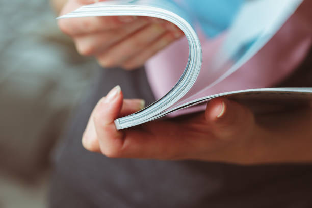 istock woman reading magazine at home 1141841945
