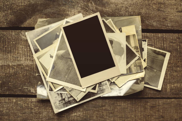 istock old photos on the wooden table 1141843193