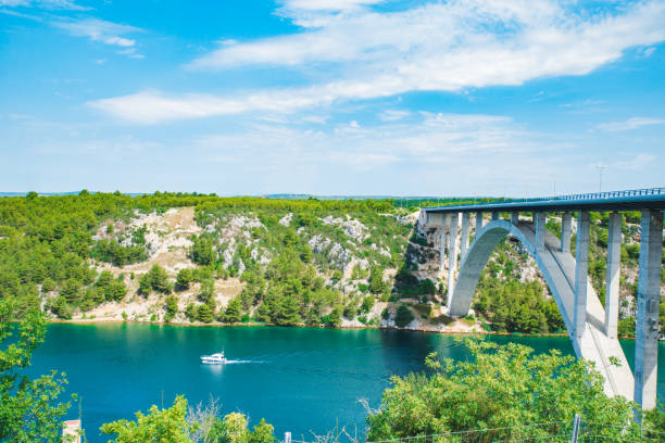 istock highway bridge cross river with blue water. summer time 1141843943