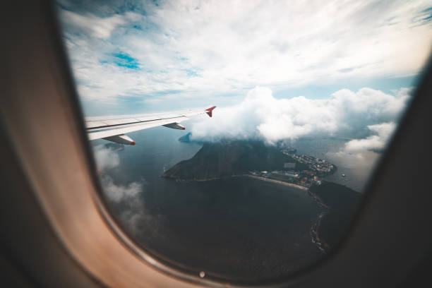 Sugar Loaf seen from a plane The iconic Pão de Açúcar seen from a plane just departed from Santos Dumont airport in Rio de Janeiro window seat vehicle stock pictures, royalty-free photos & images