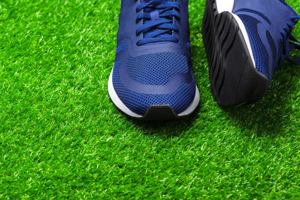 istock Sport shoes on grass 1141850700