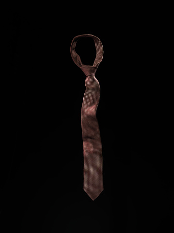 Ties for man on black background.