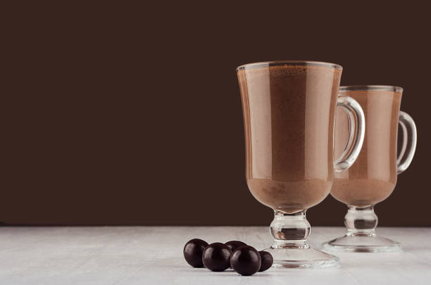 istock Exquisite chocolate dessert with round chocolate candies in dark brown interior, copy space. 1141856925