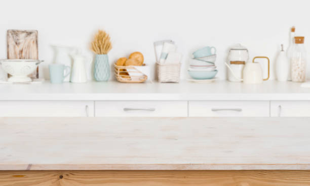 istock Wooden table on blurred kitchen counter background with cooking ingredients 1141864537