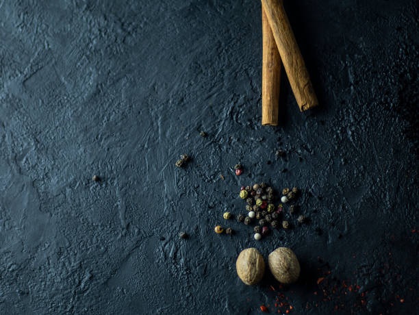 istock A set of spices on a dark stone background. 1141868736