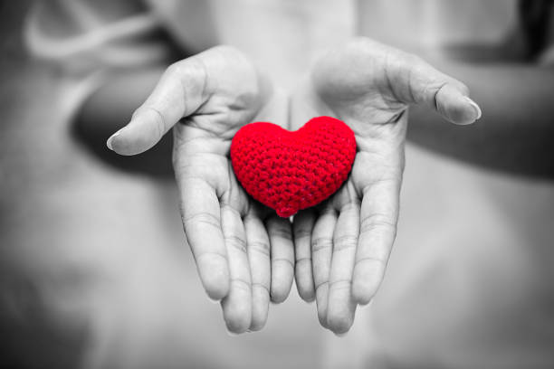 istock hand giving heart help healthcare concept 1141874323