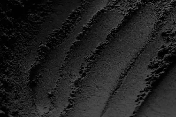 Photo of carbon powder or fine black charcoal powder texture pattern for background