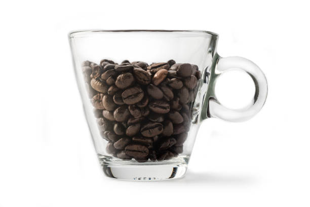 Coffee: Coffee Beans and Cup Isolated on White Background.One glass coffee cup, studio shot.