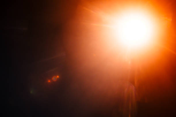 istock Abstract Natural Sun flare or Far star on the black background 1141880075