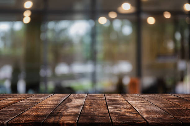istock Empty wood table top on abstract blurred restaurant and cafe background - can be used for display or montage your products 1141880086