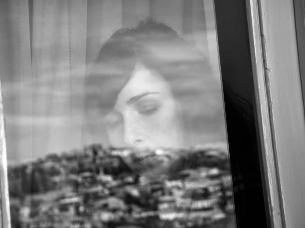 istock Woman Seen Through Window 1141880316