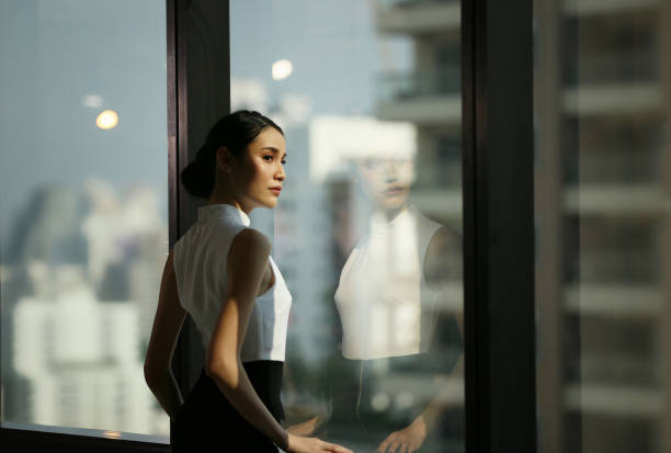 Free Stock Photo of A woman standing in front of a window | Download ...