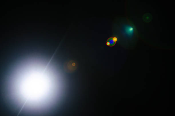 istock Abstract Natural Sun flare or Far star on the black background 1141883146