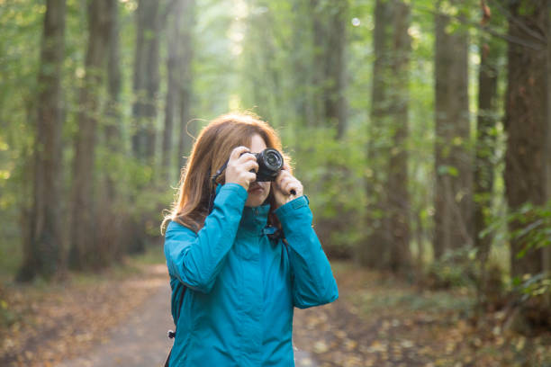 istock Young woman taking pictures 1141883785