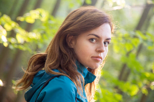 Portrait of a young woman in nature. About 25 years old, Caucasian female.