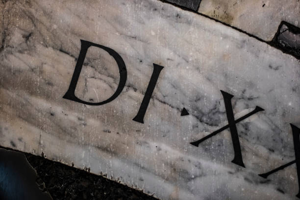 istock Roman letters close up still on a marble surface 1141885111
