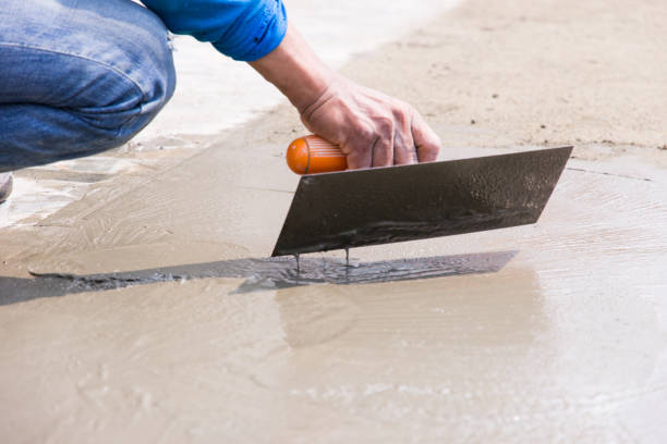 istock Midsection Of Man Leveling Wet Cement With Tool 1141890089