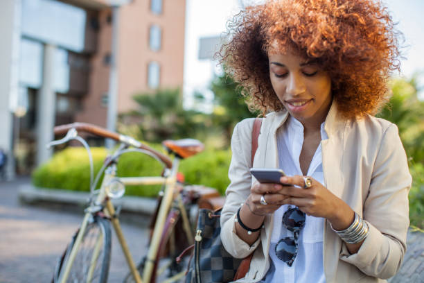 istock Young woman commuting in the morning by bicycle 1141890178