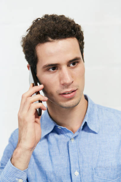 istock Handsome young businessman talking on mobile phone 1141893283