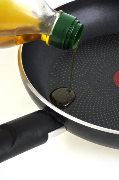 istock Pour olive oil into a frying pan 1141899717