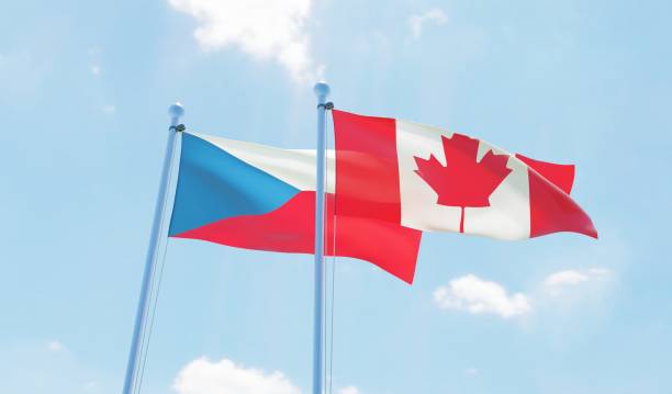 istock Canada and Czech Republic, two flags waving against blue sky 1141904596