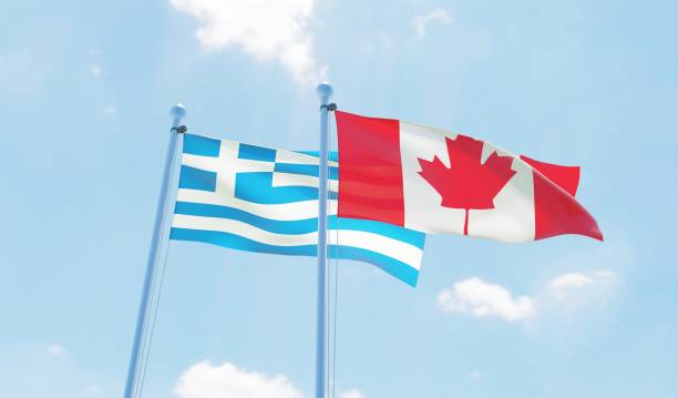 istock Canada and Greece, two flags waving against blue sky 1141904757