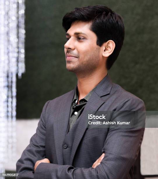 Side View Pose Of Handsome And Very Decently Clothed Indian Young Man In  His Early 20s