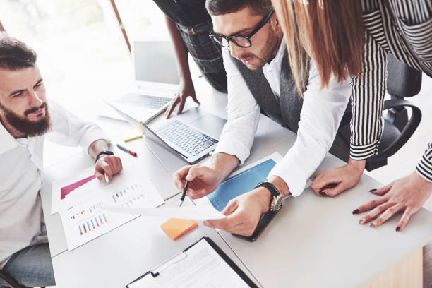 istock Four multiracial employee have work in the office using the laptop on table 1141906527