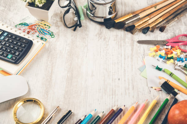istock pencils with brushes and calculator on desk 1141909821