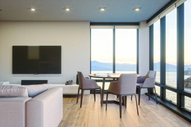 modernes luxus-wohnzimmer mit ocean view bei sonnenuntergang - hotel room contemporary summer sea stock-fotos und bilder