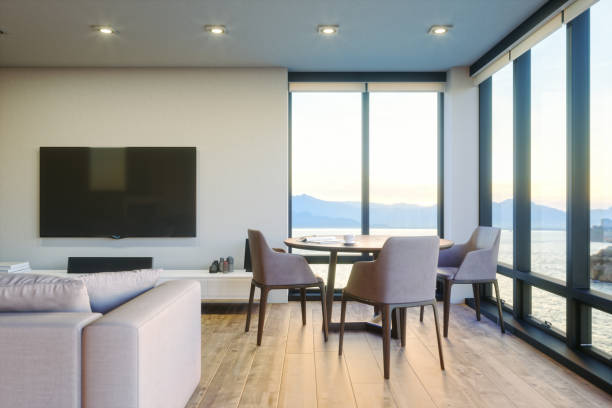 istock Modern Luxury Living Room With Ocean View At Sunset 1141909923