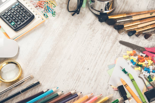 istock pencils with brushes and calculator on desk 1141910022