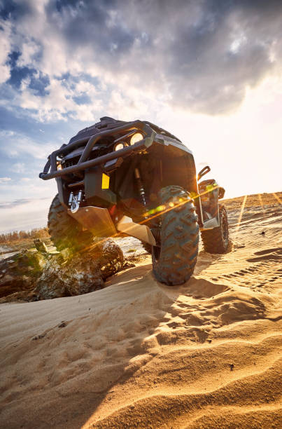 istock Racing in the sand on a four-wheel drive quad. 1141910263