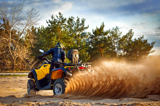 istock Racing in the sand on a four-wheel drive quad. 1141910476