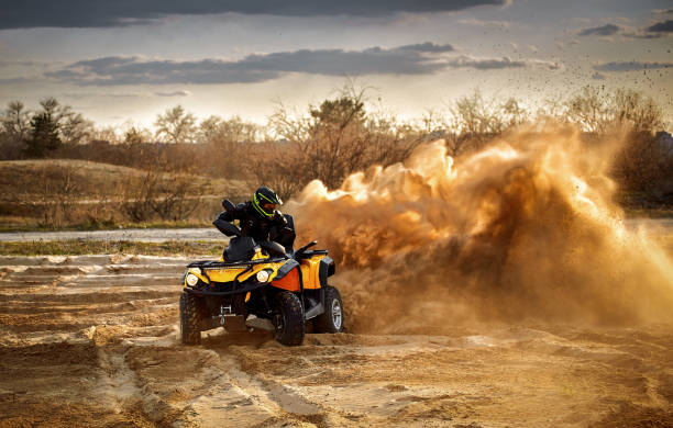 istock Racing in the sand on a four-wheel drive quad. 1141910477