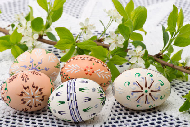 istock Painted Easter eggs with a twig on the desk 1141911629