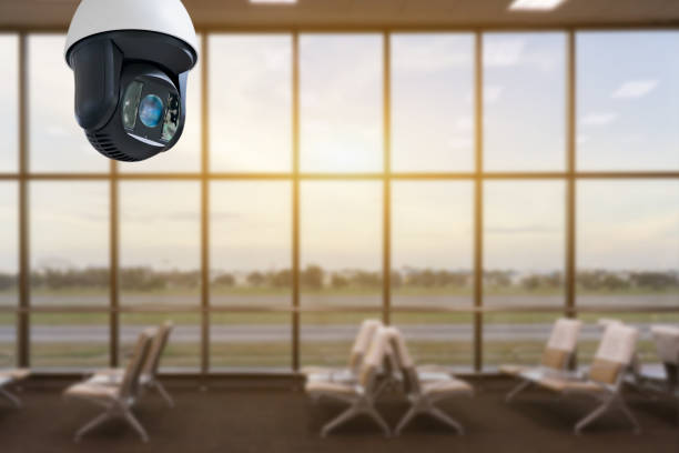 istock Closed-circuit television,Security CCTV camera or surveillance system in   background of Checkpoint - Body and bag Luggage Scan Machine ,Secure Airport Check In,vintage color 1141912997