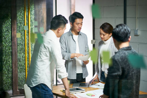 young asian business people meeting in office stock photo