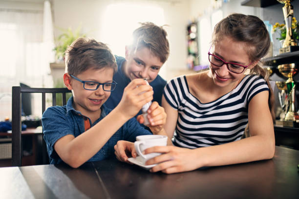 Kids playing an April fools day prank Three kids playing an April fools day prank. The boys and girl are adding salt to mother's tea.
Nikon D850 salt character stock pictures, royalty-free photos & images